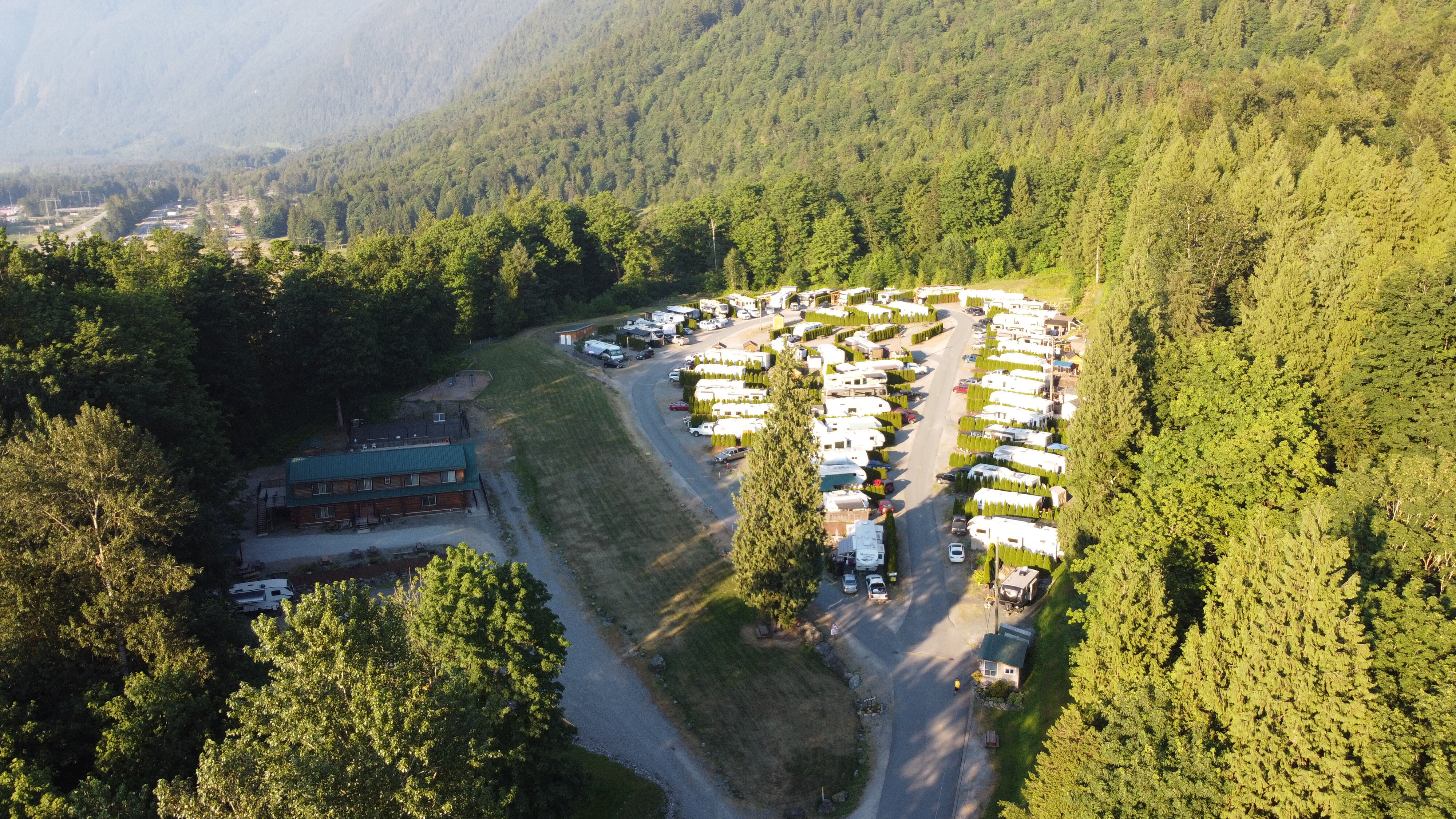 Aerial view of RV sites in a forest clearing under Mt. Cheam at Camp Bridal near Bridal Falls
